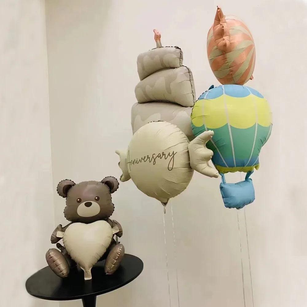 Teddy bears in balloons